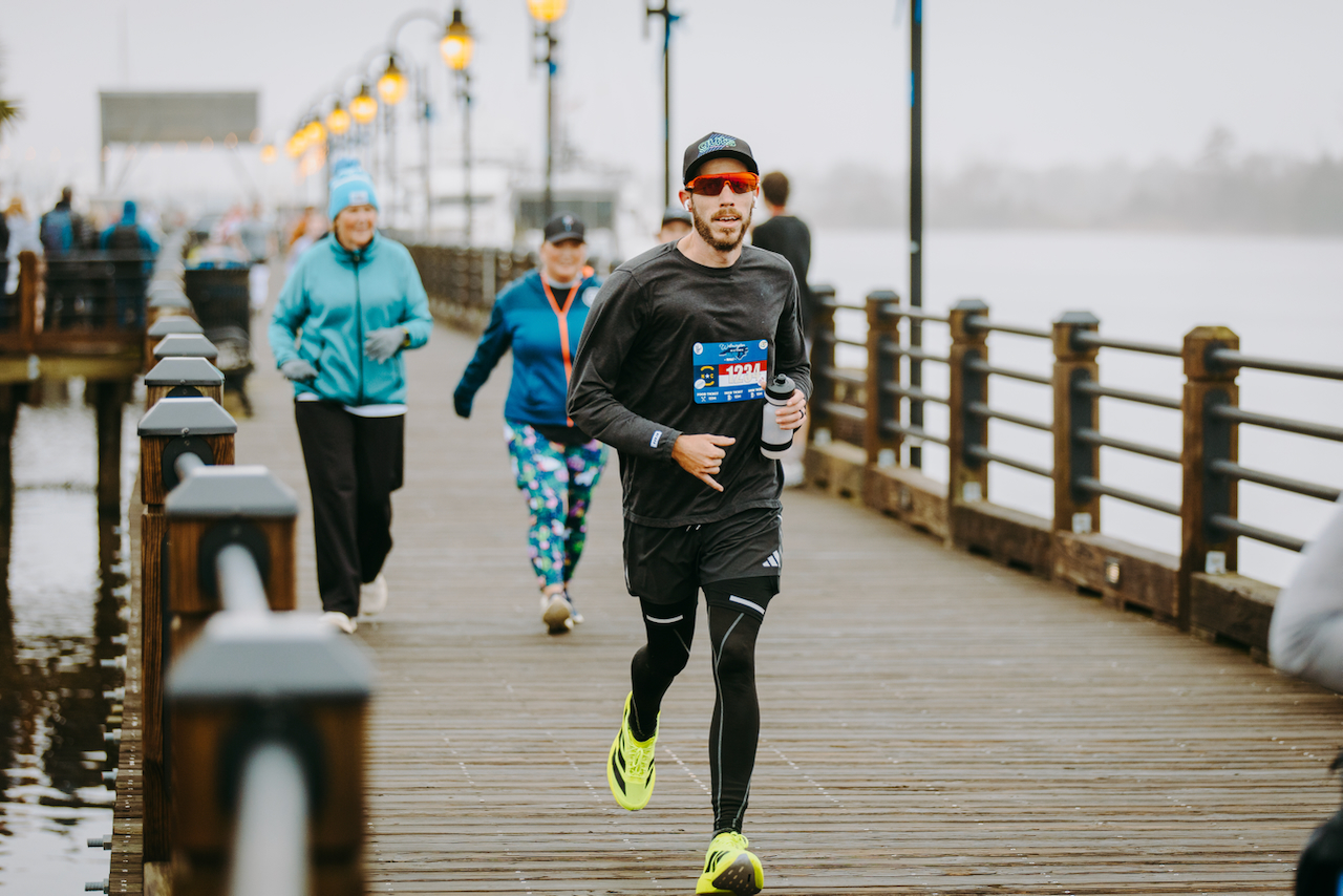 Brent Alexander running the Wilmington Historic Half on the Riverwalk in Wilmington, North Carolina